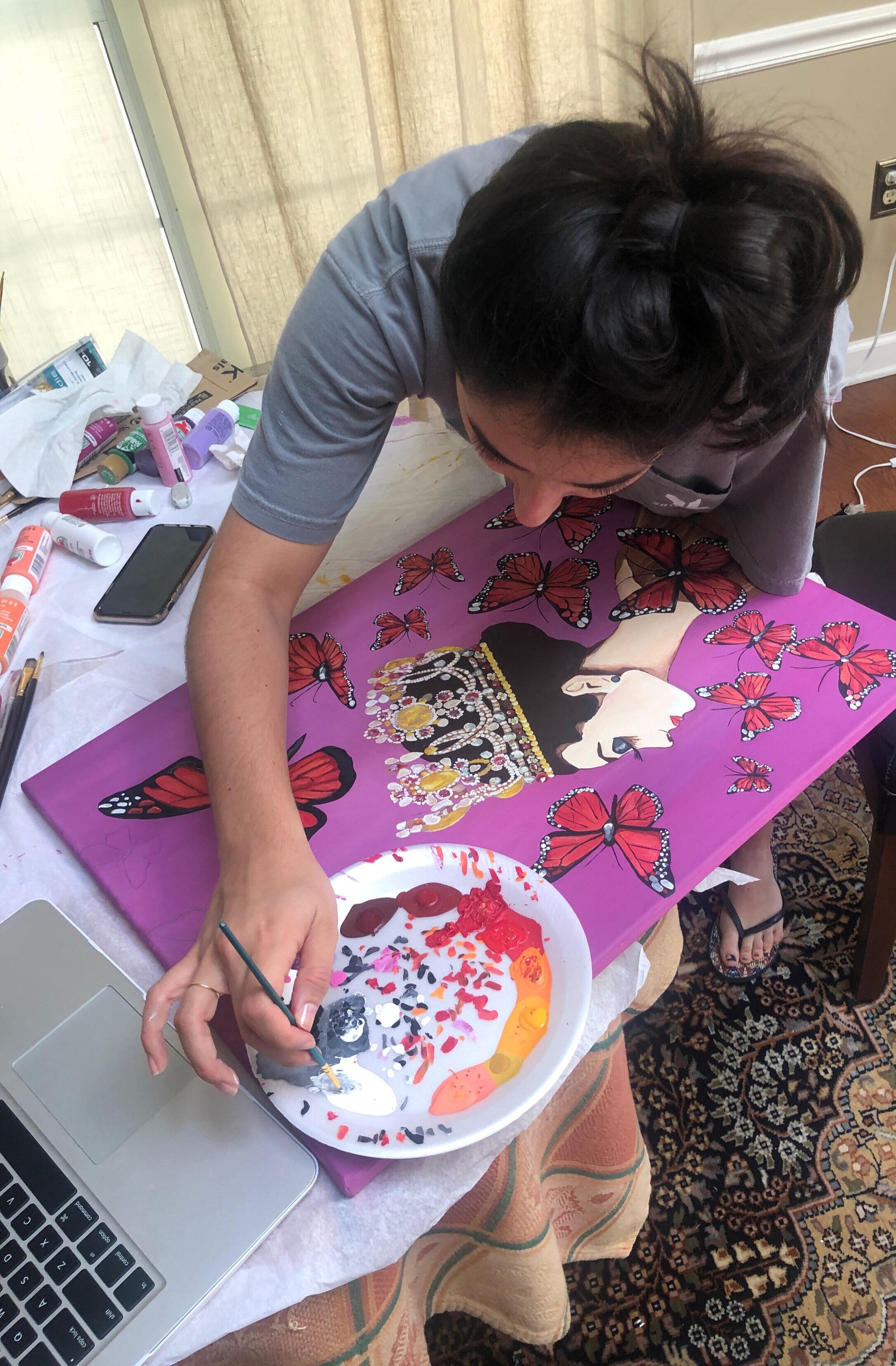 Sarah Hayek has returned to an old hobby, painting, to relieve stress." This is a time to readjust and reset and strip back down to what you love doing,” she said. Photo by Reya Hayek