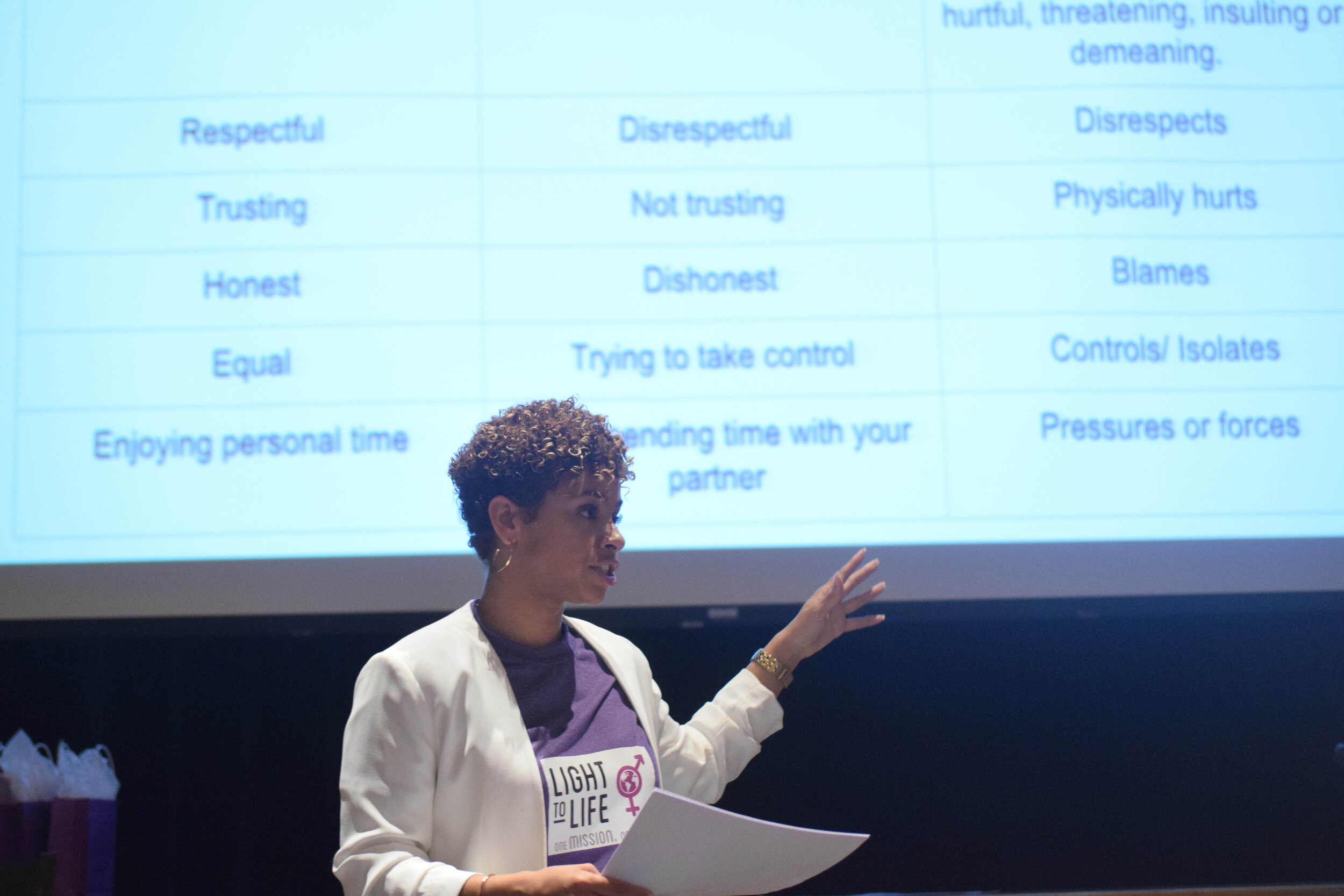 Tenaj Moody, seen here during a recent public presentation, founded the small consulting firm Light To Life LLC to stop the kind of dating abuse and domestic abuse she fell prey to in high school. She frequently speaks to high school and college stu…