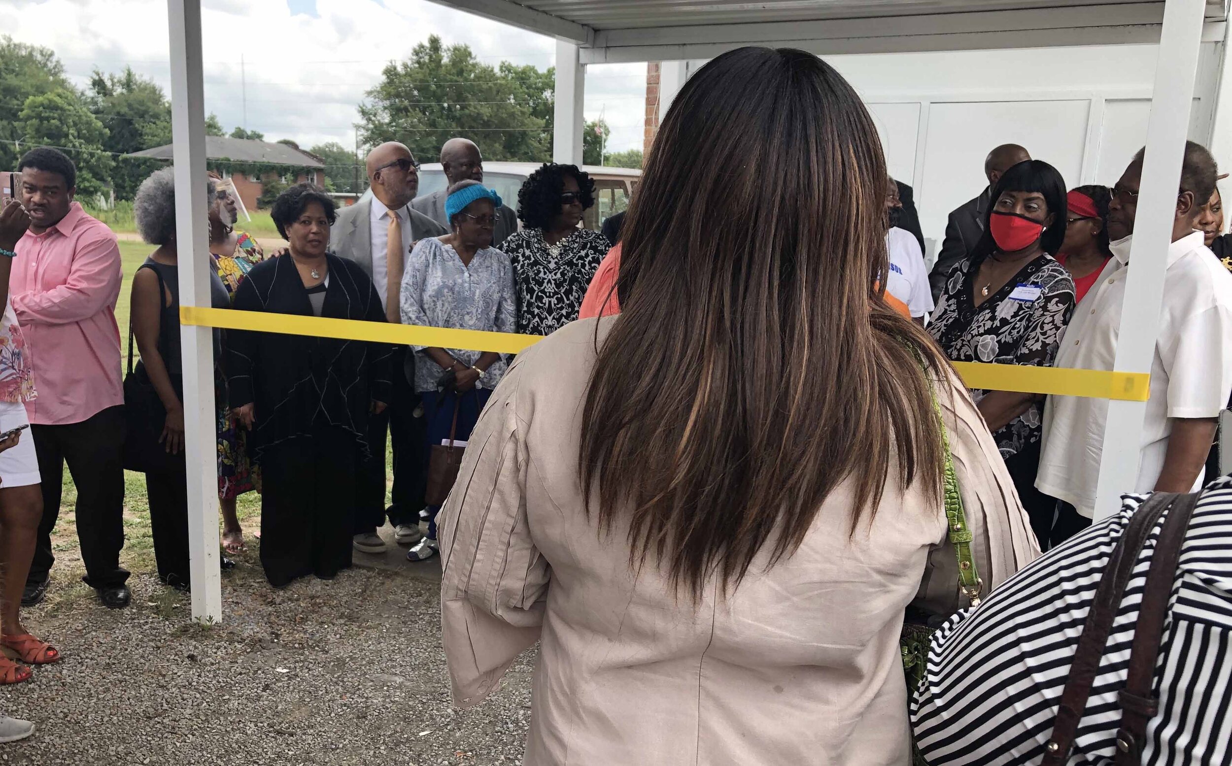 Reena Evers-Everette, in black at left in front, attends the ribbon cutting July 10, 2021. of the Mound Bayou Museum of African American History on the 134th anniversary of the municipality’s founding. Ann Marie Cunningham/MCIR