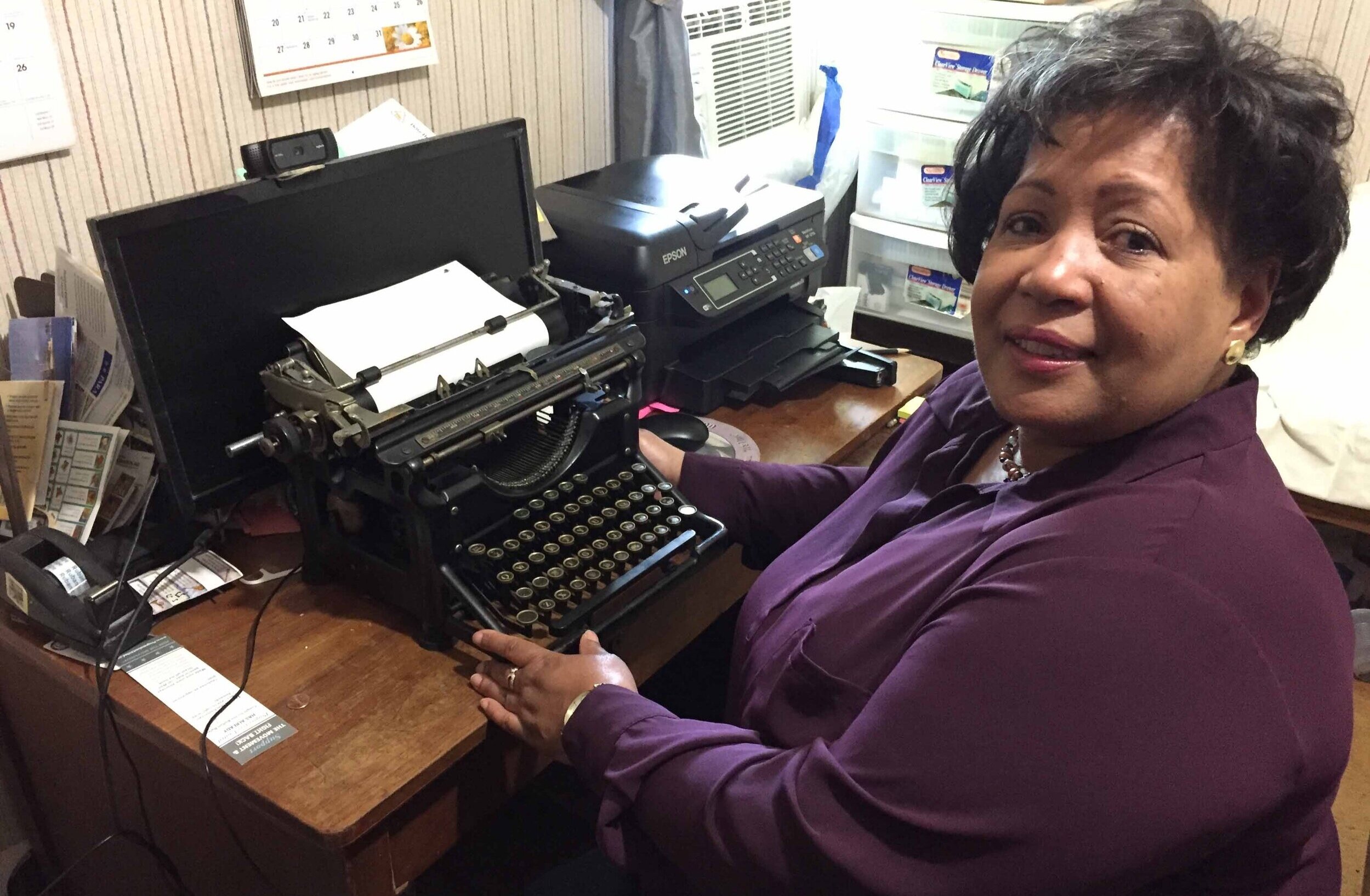 Reena Evers-Everette, Medgar Evers' daughter, works at his desk and typewriter that he used at Magnolia Mutual. Desk and typewriter are now in the new Mound Bayou Museum of African American History. MCIR
